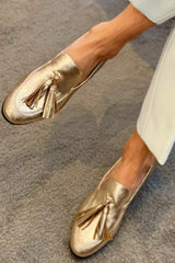 Gold loafers with decorative details and shiny metallic tassels - Threadford
