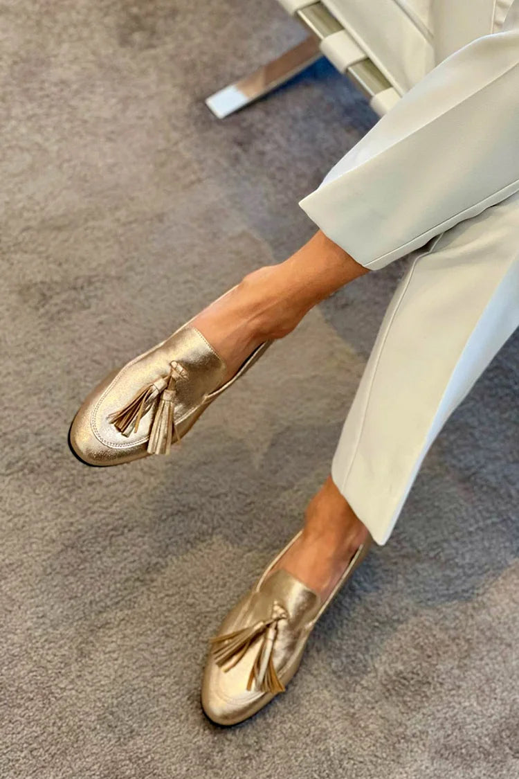 Gold loafers with decorative details and shiny metallic tassels - Threadford