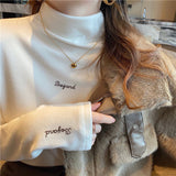 Amelie | Oversized Turtleneck Sweater with Embroidered Details