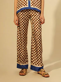 Pantaloni elastici larghi con stampa a scacchiera e strisce blu